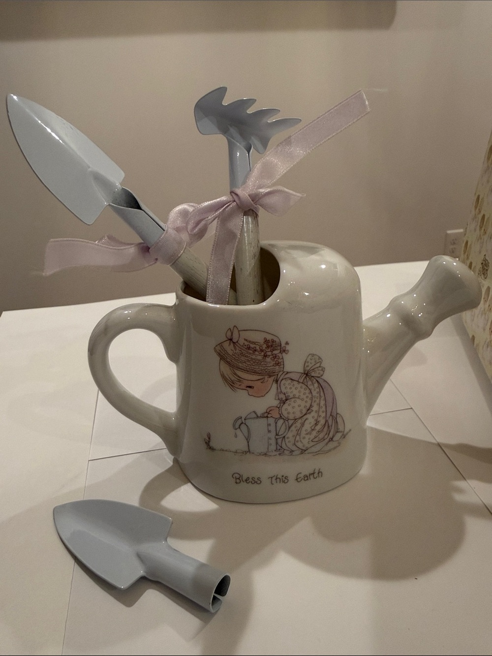 Enesco Cream and Light Lilac Ceramic Watering Can Vase with Garden Tool Accents